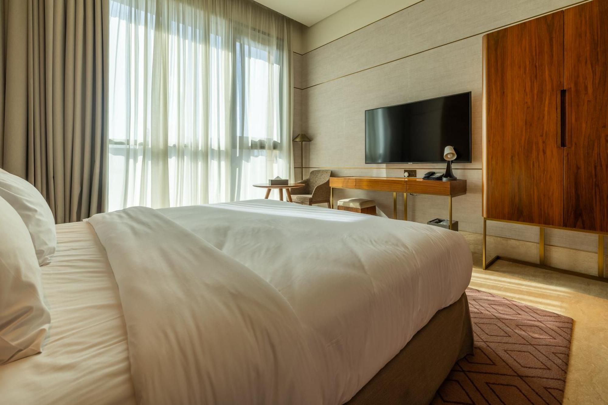 Shirvan Hotel City Yard Yidda Exterior foto A bedroom at the hotel